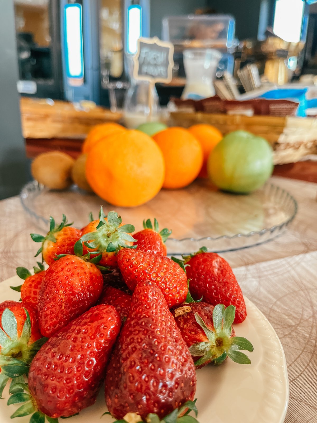Strawberries, oranges and fruit on the breakfast buffet.